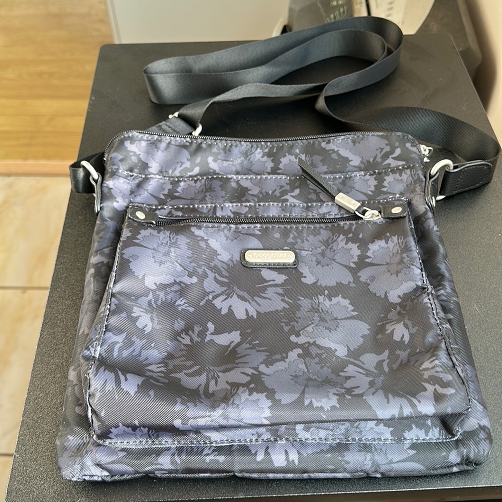 Baggalini black crossbody with gray floral design